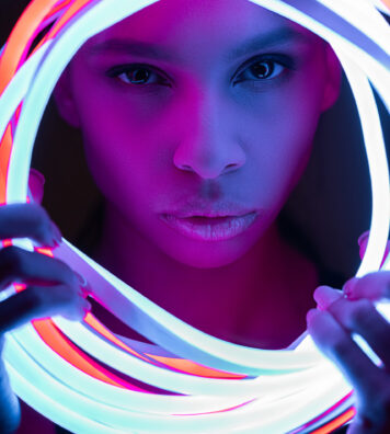 portrait of futuristic african american woman in neon lighting