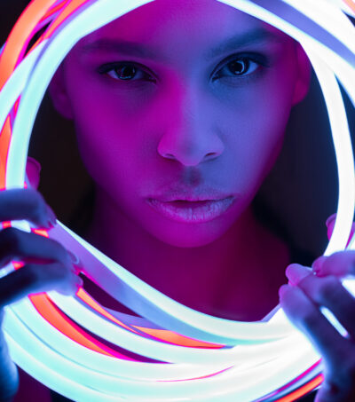 portrait of futuristic african american woman in neon lighting